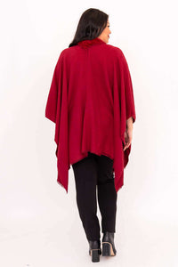 Back view of woman wearing scarlet wrap, showing draped design