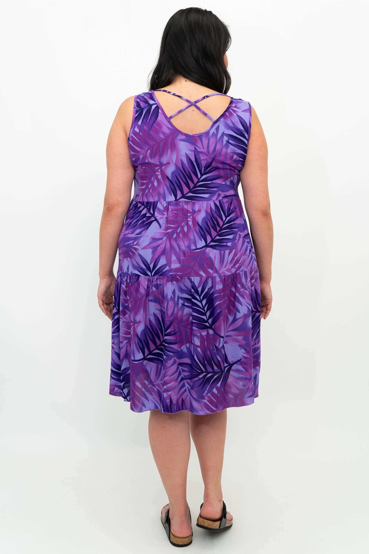 Back view showing criss cross detail of purple palm print dress