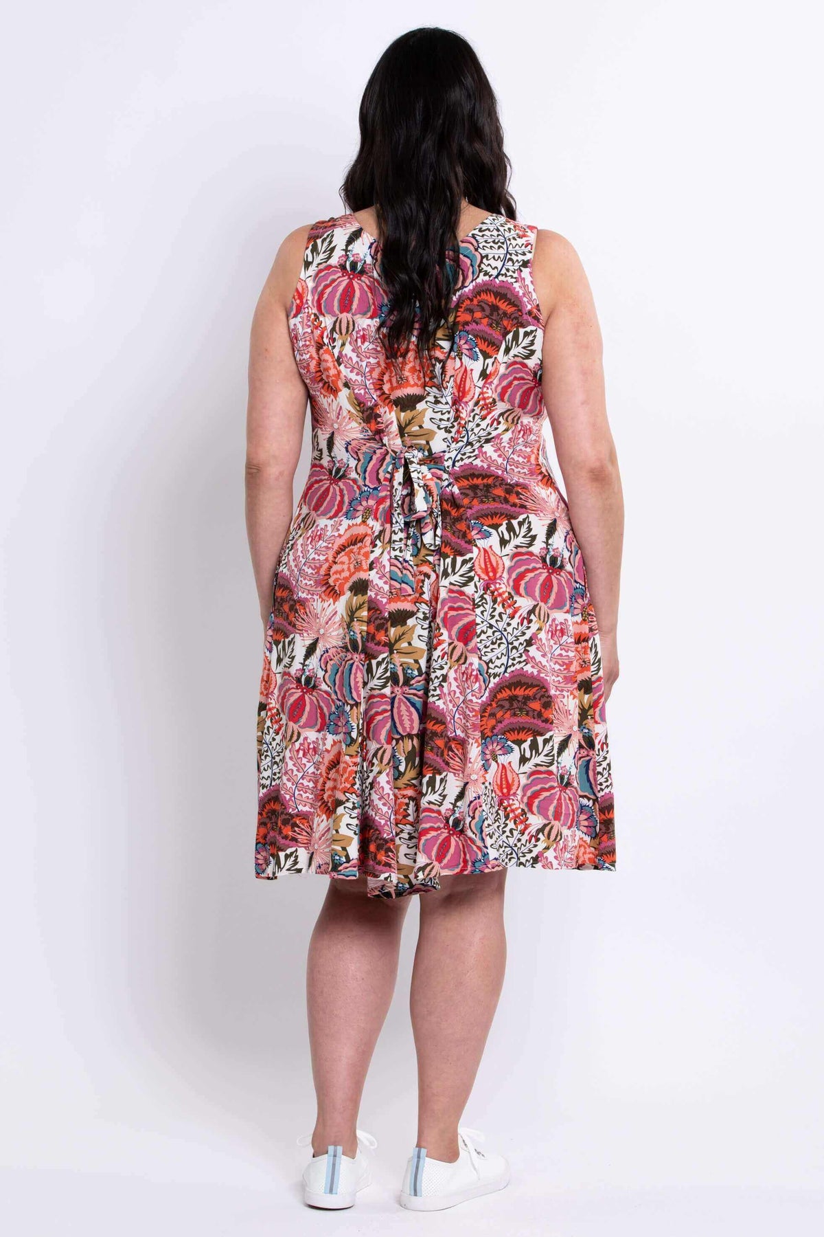 Back view of floral A-line summer dress with tie belt detail