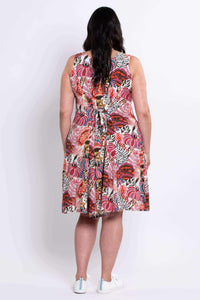 Back view of floral A-line summer dress with tie belt detail