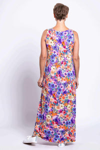 Back view of woman showing the floral print and cut of sleeveless maxi dress