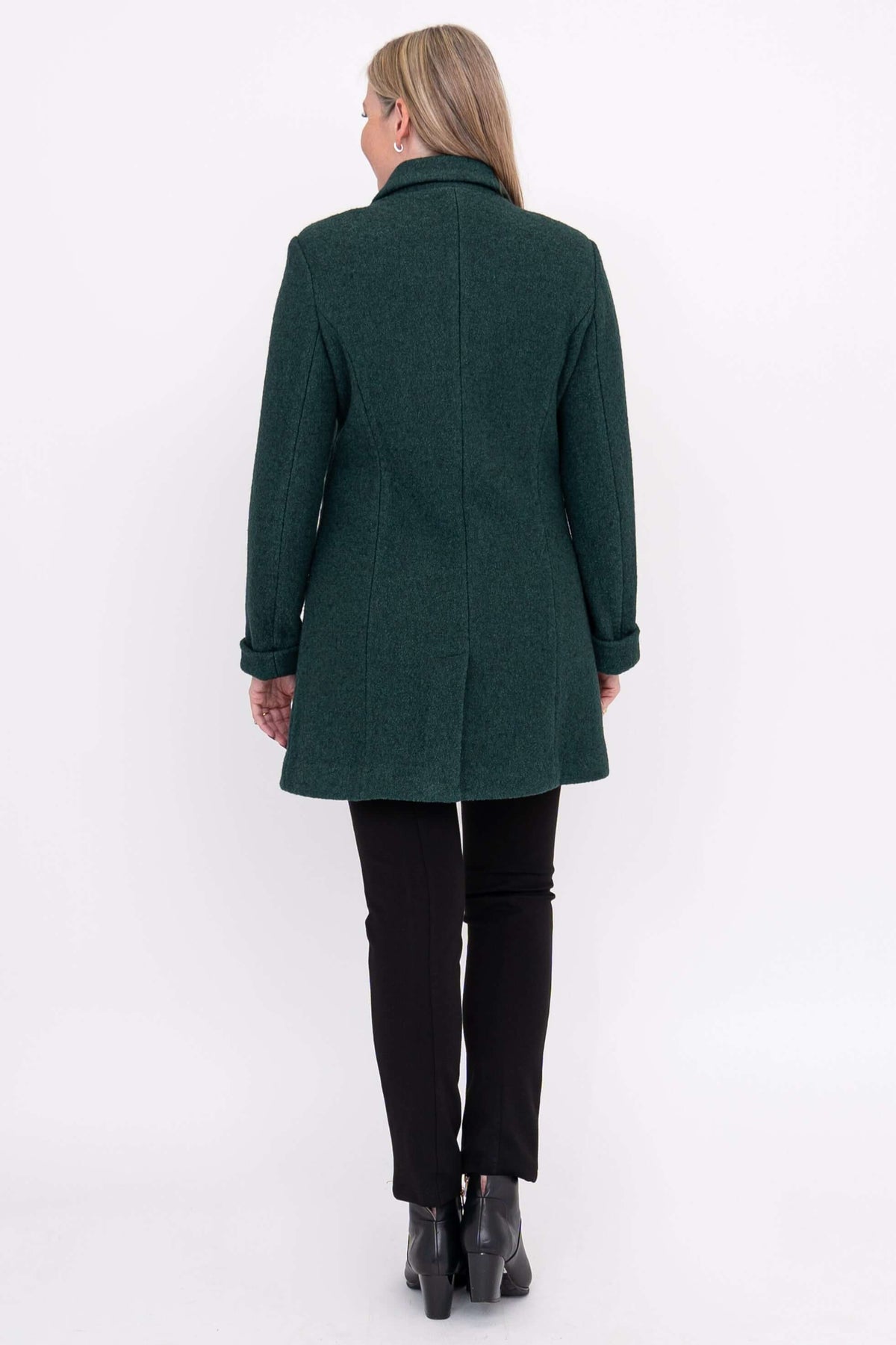 Back view of a woman wearing a dark green wool coat