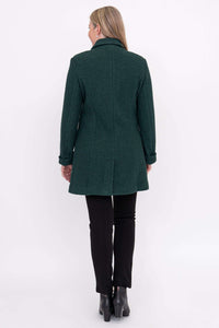 Back view of a woman wearing a dark green wool coat