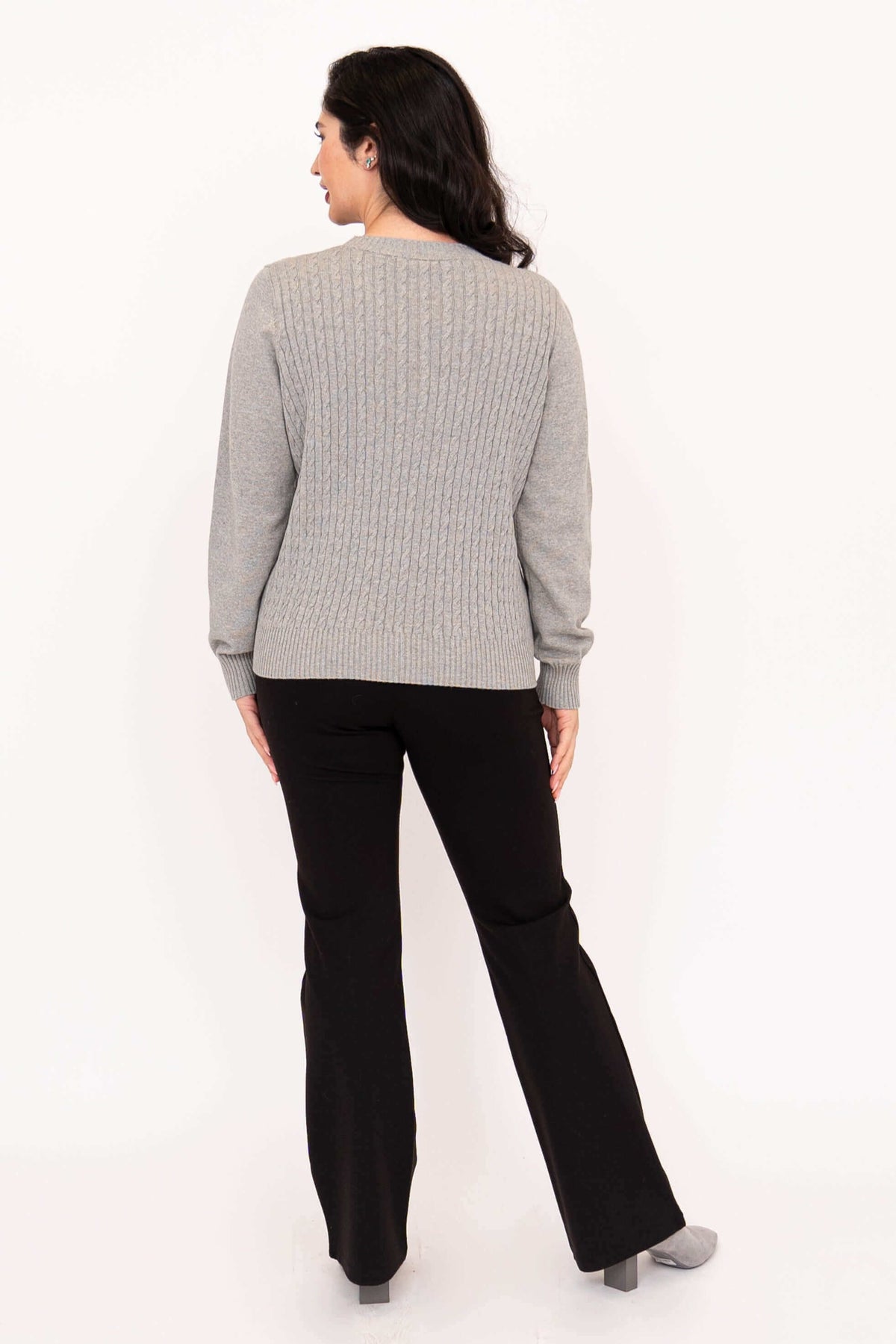 Back view showing cable knit detail of grey sweater