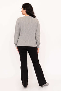 Back view showing cable knit detail of grey sweater