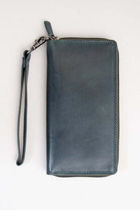 Back view of handmade blue leather wallet with wrist strap
