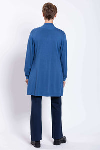Back view of woman wearing a long blue cardigan, showing length and fit