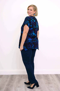 Model showing back view of midnight blossom curved-hem tunic