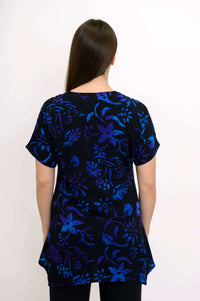 Back view of woman in midnight blossom floral curved-hem tunic