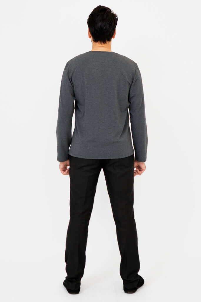 Rear view of man wearing charcoal V-neck long sleeve shirt and black pants