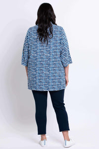 Back view of model in blue batik Shirley blouse highlighting relaxed fit