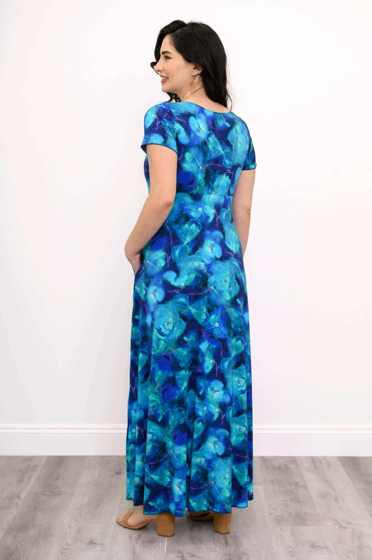 Back view of model in blue floral bamboo maxi dress showing fit and coverage