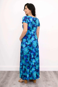 Back view of model in blue floral bamboo maxi dress showing fit and coverage
