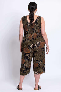 Back view of model in wide leg jumpsuit with safari pattern