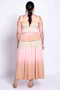 Back view of model showing smocked tank and flowing dip-dye maxi skirt