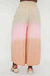 Back view of ombre wide leg pants in peach and beige