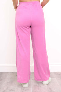 Back view of pink corduroy wide-leg pants with elastic waistband