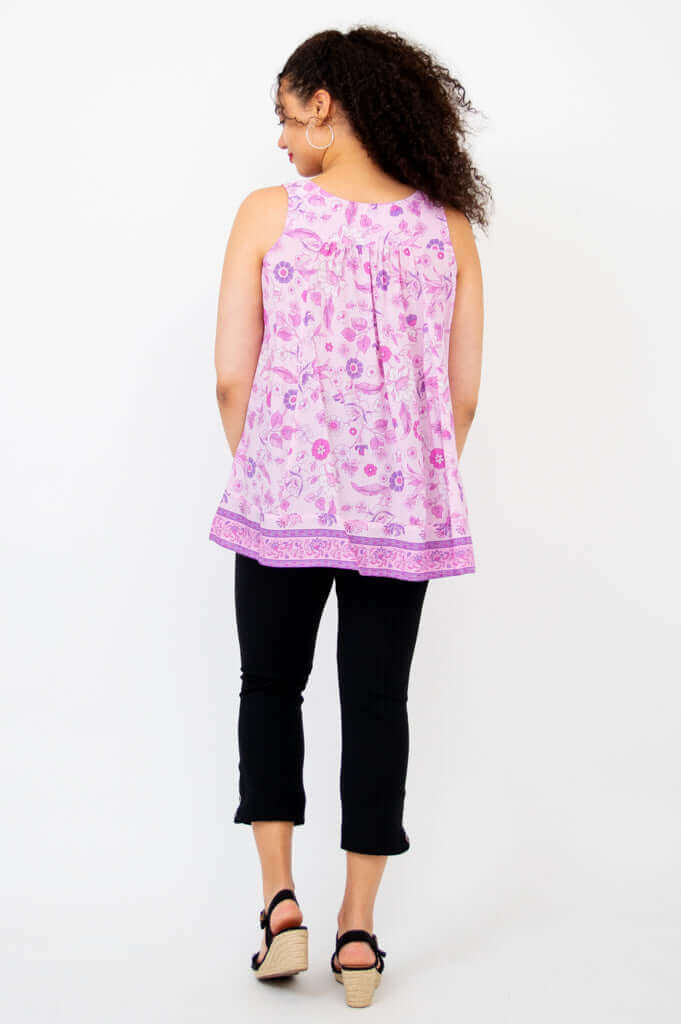 Back view of model wearing pink floral pleated tank top