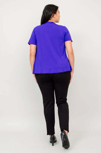 Back view of model wearing a purple short sleeve open jacket and black pants