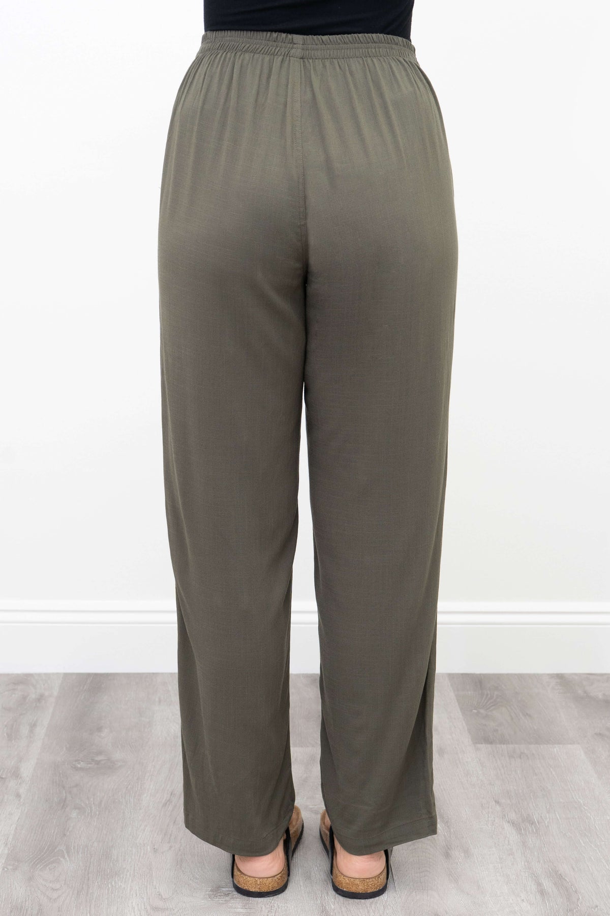 Rear view of olive green linen-bamboo trousers with elastic waist