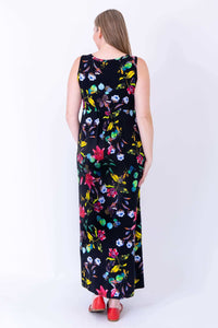 Back view of sleeveless black floral maxi dress, showing details of print and fit
