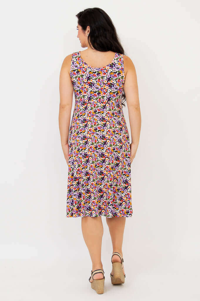 Back view of a woman wearing the floral fit and flare dress