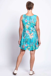Back view of woman in blue floral bamboo linen dress displaying the flouncy skirt
