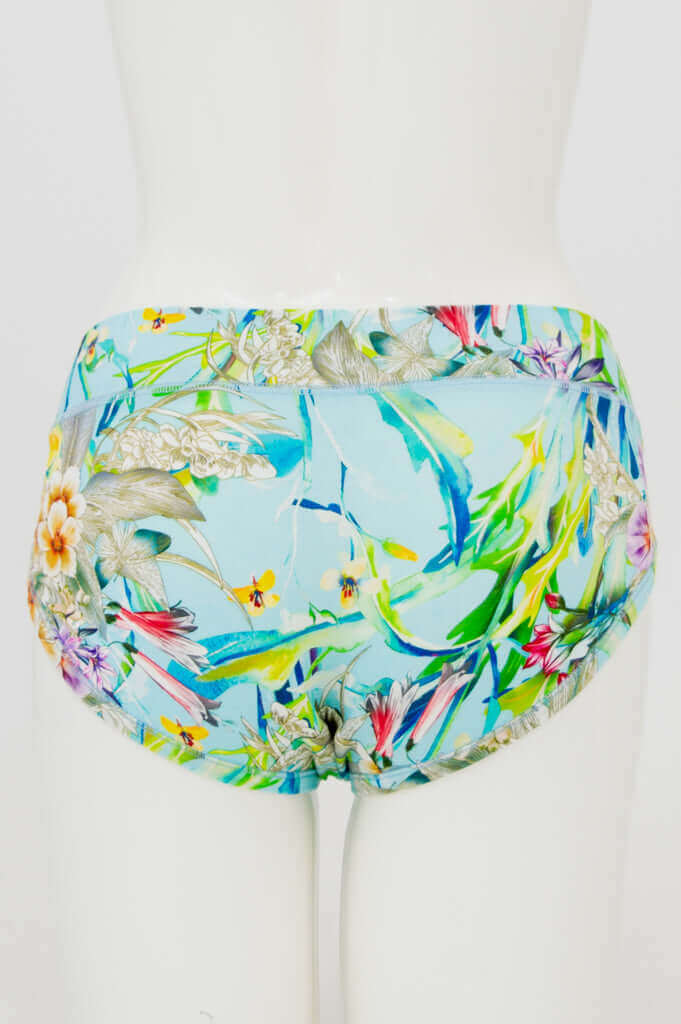 Back view of hipster underwear with a blue tropical floral design on a mannequin