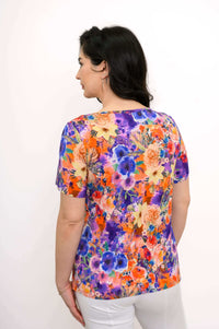 Back view of the woman wearing a multicolored floral bamboo top