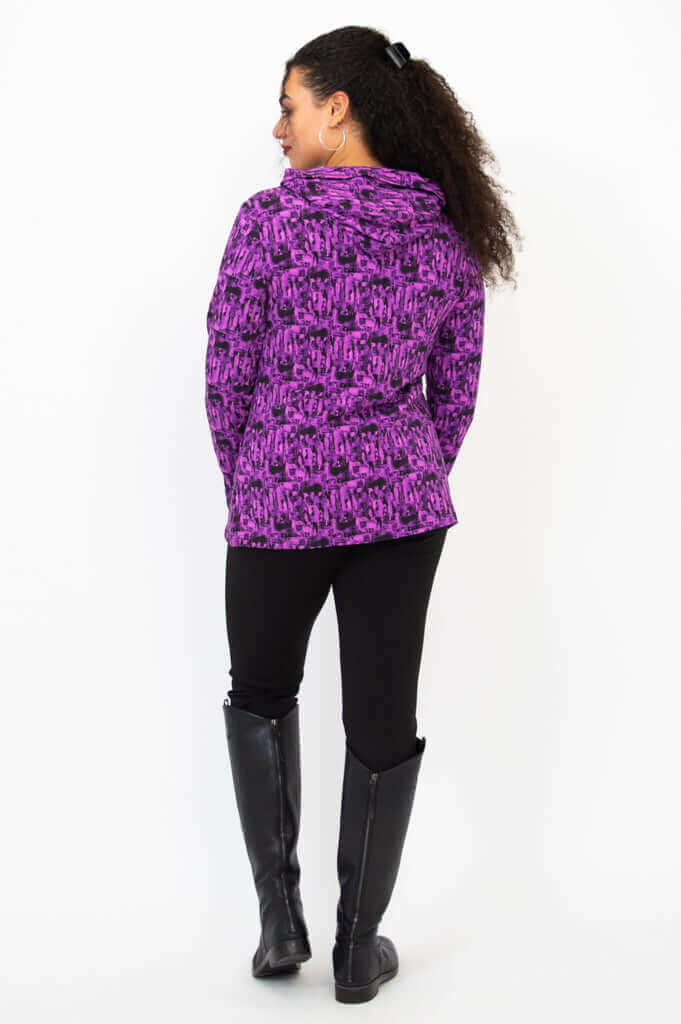Back view of woman in violet abstract print hoodie with hood