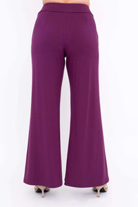 Back view of wide leg plum bamboo pants with seam and model in two-tone heels