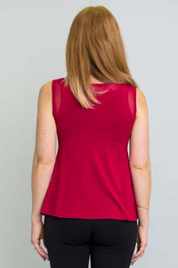 Back view of woman wearing a sleeveless red tank top with mesh detail