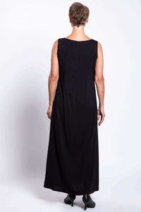 Back view of woman in sleeveless black shift maxi dress