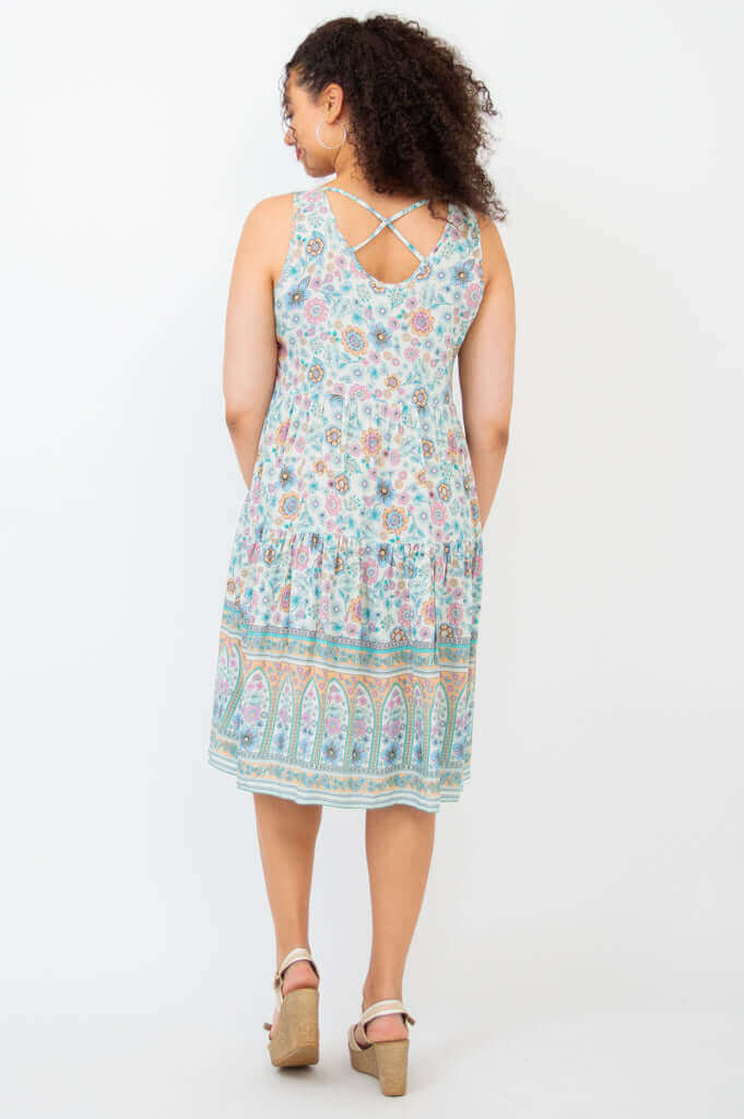 Back view of woman modeling Kayana dress with criss cross detail