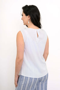 Back view of woman showing button closure on white sleeveless tank