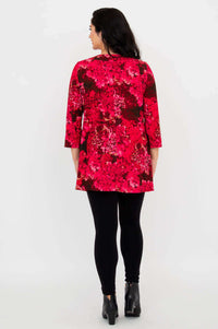 Back view of woman showing the Vana tunic’s floral pattern and relaxed fit