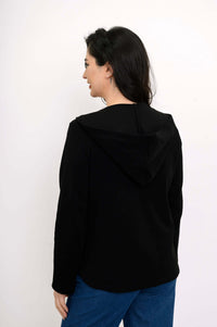 Back view of woman showing the hood and tailored design of the black Bowen jacket