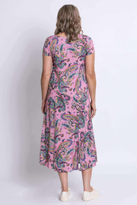 Back view of woman wearing pink paisley midi dress with short sleeves