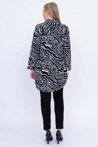 Back view of woman wearing a zebra batik print tunic shirt