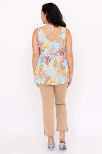 Back view of woman wearing blue leaf print tank top showing criss cross detail