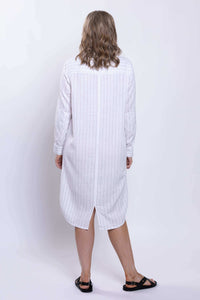 Back view of a striped white duster dress, showcasing the rear slit hem