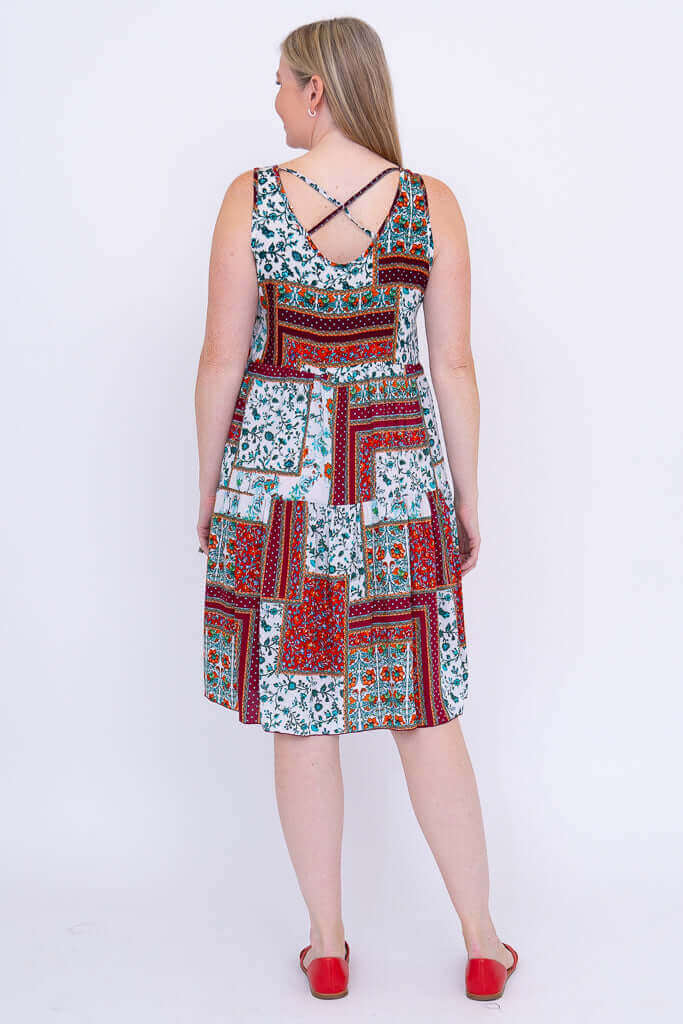 Back view showing the criss cross detail of a sleeveless patchwork dress