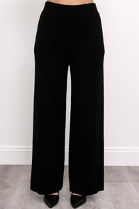 Comfortable onyx-colored pull-on pants showing side seam pockets and a fluid drape, shown on a white background.