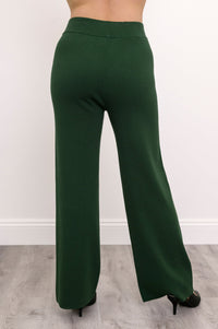 Back view of deep sage green straight-leg pants, showcasing a flattering smooth rear drape and comfortable fit.
