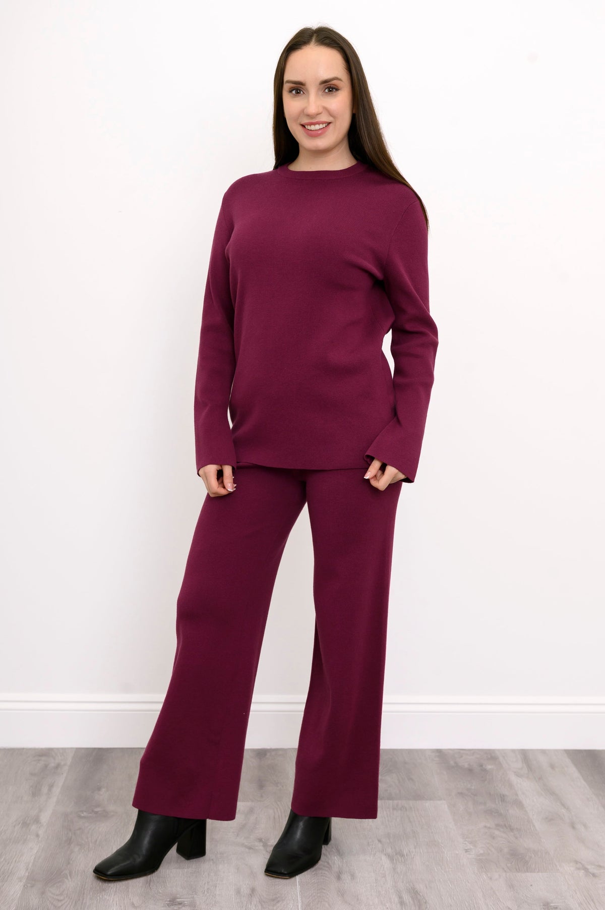 Women's casual berry-toned lounge pants styled as a matching set against a plain white backdrop, front view.