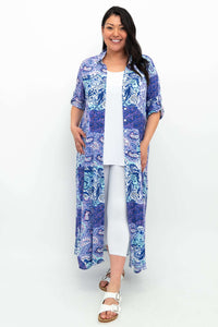 Model styling bamboo linen maxi shirt dress open as a duster with white pants