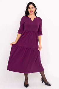 Bernadette Long Dress styled in purple, model holding skirt side