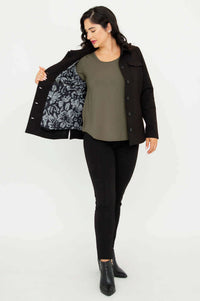 Model displaying floral printed lining inside the black jacket