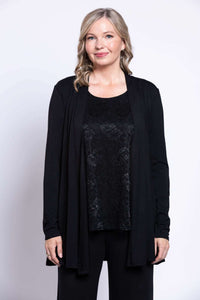 Woman in black lace tank top with open black cardigan, front view