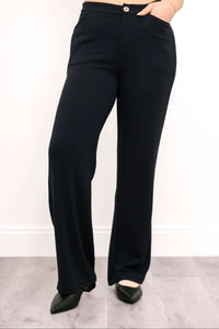 Front view of black high-waisted straight leg pants with hand in pocket